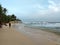 National fishing residents of Sri Lanka who sit on poles near the shore of the evening Indian ocean, looking at the waves, colored