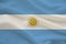 National flag of Argentina on delicate silk with wind folds, travel concept, immigration, politics