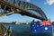 The National flag of Australia flay under Sydney Harbour Bridge
