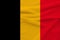 National flag of belgium on gentle silk with wind folds, travel concept, immigration, politics, copy space, close-up