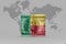 National flag of benin on the dollar money banknote on the world map background .3d illustration