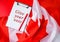 The National Flag of Canada. Canadian Flag or the Maple Leaf with paper note message text. Election day, give vote, your