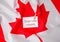 The National Flag of Canada. Canadian Flag or the Maple Leaf with paper note message text. Election day, give vote, your