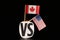 A national flag of Canada and flag of united states. Both lands have different opinions but same language