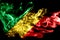 National flag of Congo made from colored smoke isolated on black background. Abstract silky wave background.