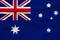 The national flag of the country of Australia on gentle silk with folds from the wind, the concept of travel, immigration,