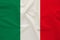 The national flag of the country of Italy on gentle silk with wind folds, travel concept, immigration, politics, copy space, close