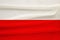 National flag of the country of Poland on gentle silk with wind folds, travel concept, immigration, politics