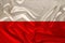 National flag of the country of Poland on gentle silk with wind folds, travel concept, immigration, politics