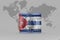 National flag of cuba on the dollar money banknote on the world map background .3d illustration