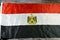 The national flag of Egypt, a tricolour consisting of the three equal horizontal red, white, and black bands, The flag bears Egypt