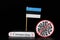 National flag of Estonia with cell of covid-19 and word coronavirus. Fast spreading disease worldwide. Covid-2019 is a stronger