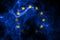 National flag of European Union made from colored smoke isolated on black background. Abstract silky wave background.