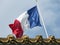 National flag of France against a blue sky