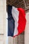 National flag of France with detail of triumphal arch, Paris, Fr