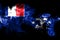 National flag of French Southern and Antarctic Lands made from colored smoke isolated on black background. Abstract silky wave bac