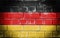 The national flag of Germany depicted on a brick wall