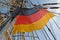 National flag of Germany flutters among tackles of the sailing vessel