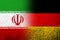 The national flag of Germany with  Iran National flag. Grunge background