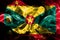 National flag of Grenada made from colored smoke isolated on black background