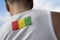 The national flag of Guinea on the athlete& x27;s back