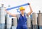 National flag of Israel in the hands of girl in overalls against background of modern metallurgical plant