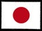 The national flag of Japan illustration. Official colors and proportion of flag of Japan .Old posted stamp isolated on black back