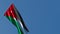 The national flag of Jordan is flying in the wind