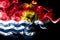 National flag of Kiribati made from colored smoke isolated on black background. Abstract silky wave background