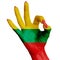 The national flag of Lithuania is painted on a female hand showing the OK sign