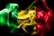 National flag of Mali made from colored smoke isolated on black background