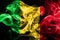 National flag of Mali made from colored smoke isolated on black background