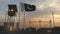National flag of Pakistan above military base at sunset