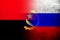 National flag of Russian Federation with Republic of Angola national flag. Grunge background