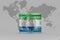 National flag of sierra leone on the dollar money banknote on the world map background .3d illustration