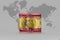 National flag of spain on the dollar money banknote on the world map background .3d illustration