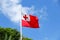 National flag of Tonga against blue sky