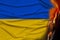 National flag of Ukraine on gentle silk with wind folds, travel concept, immigration, politics