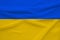 National flag of Ukraine on gentle silk with wind folds, travel concept, immigration, politics