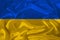 National flag of Ukraine on gentle silk with wind folds, travel concept, immigration, politics, close-up, copy space, illustration