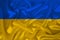 National flag of Ukraine on gentle silk with wind folds, travel concept, immigration, politics, close-up, copy space, illustration