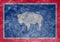 The national flag of the US state Wyoming in against a gray textile rag on the day of independence in different colors of blue red