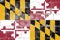 National flag of USA state of Maryland against the background of black and yellow chess and red-white crosses on Independence Day