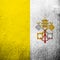 National flag of Vatican City State. Grunge background