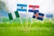 National Flags of Argentina, Iceland, Croatia, Nigeria. Flags on green grass on football stadium