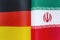 National flags of Germany and Iran close-up