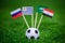 National Flags of Russia, Saudi Arabia, Egypt, Uruguay. Flags on green grass on football stadium