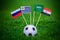 National Flags of Russia, Saudi Arabia, Egypt, Uruguay. Flags on green grass on football stadium