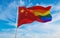 national lgbt flag of China flag waving in the wind at cloudy sky. Freedom and love concept. Pride month. activism, community and