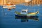 National maltese bout luzzu in malta bay between Birgu and Kalkara